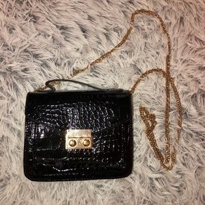Black and gold crossbody bag with chain
